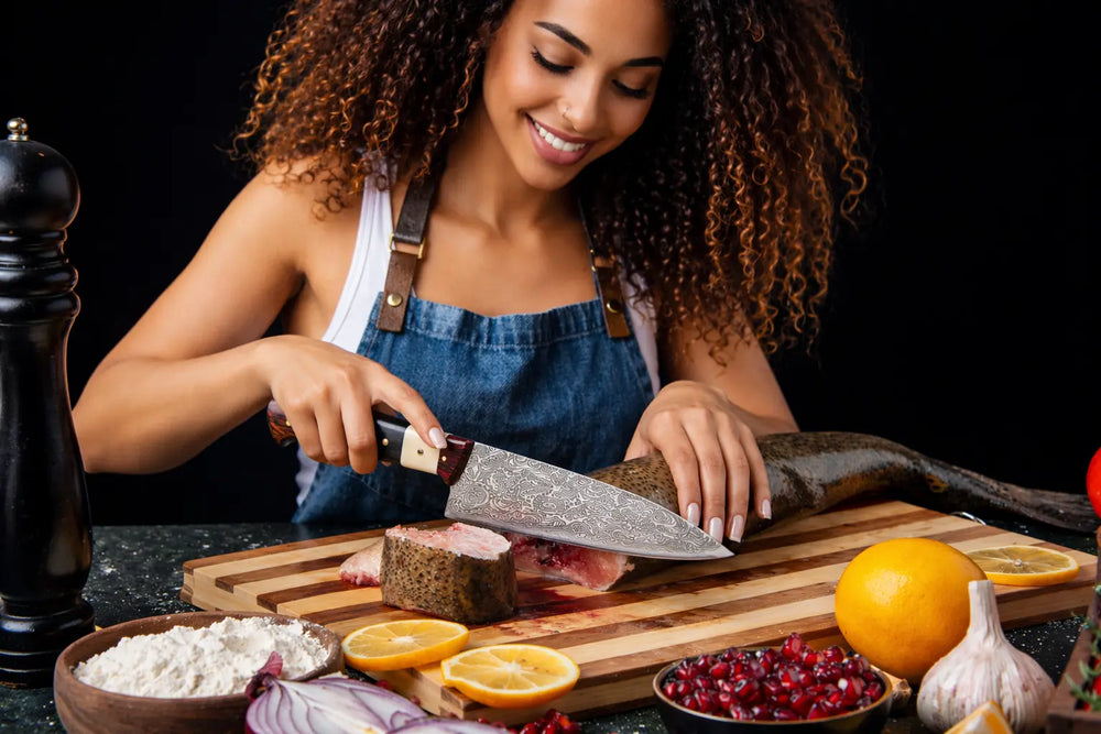 Genuine handmade Damascus steel chef knife by ZYZO Blades — layered steel pattern detail